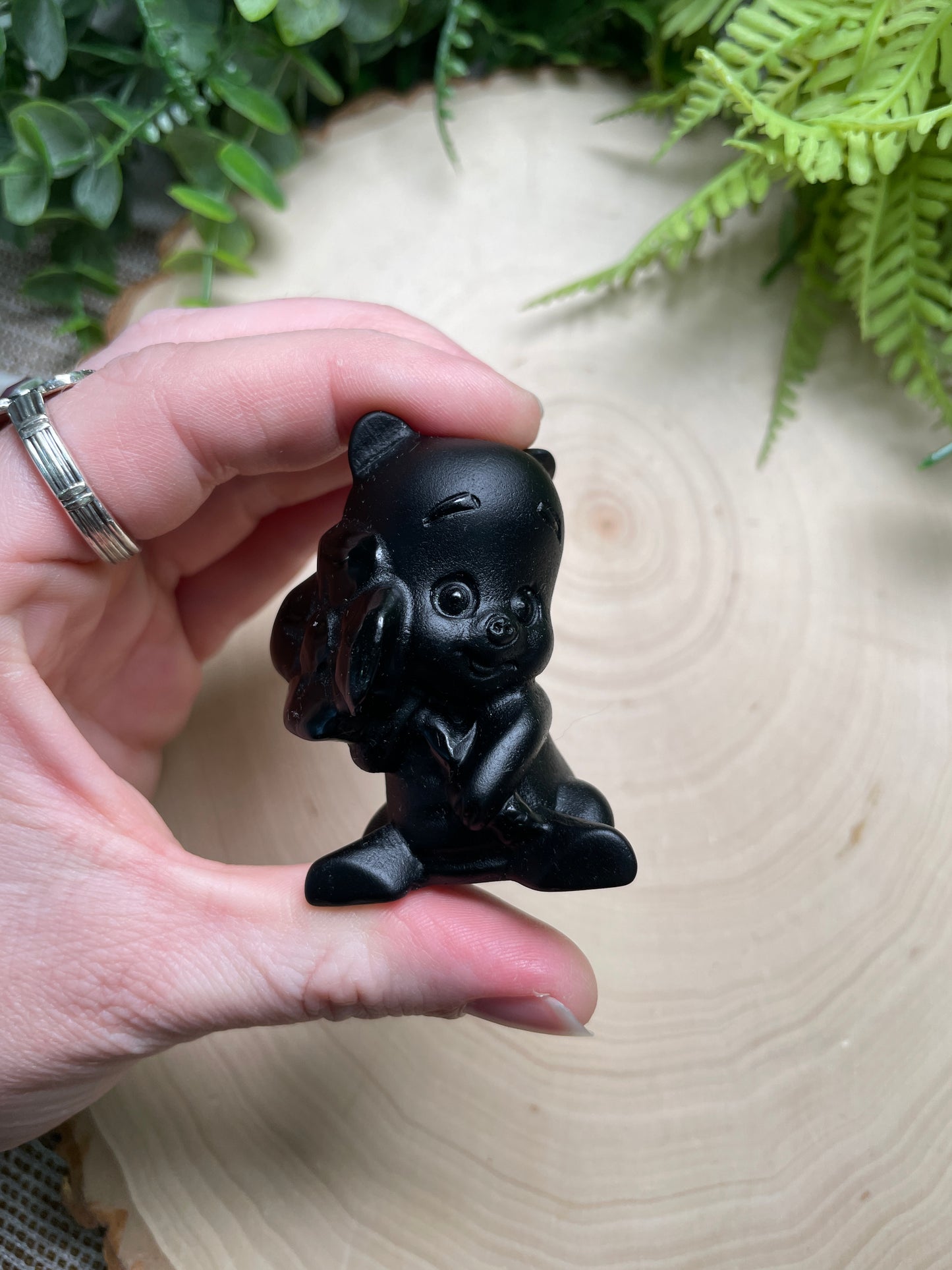 Obsidian Piglet with a Flower